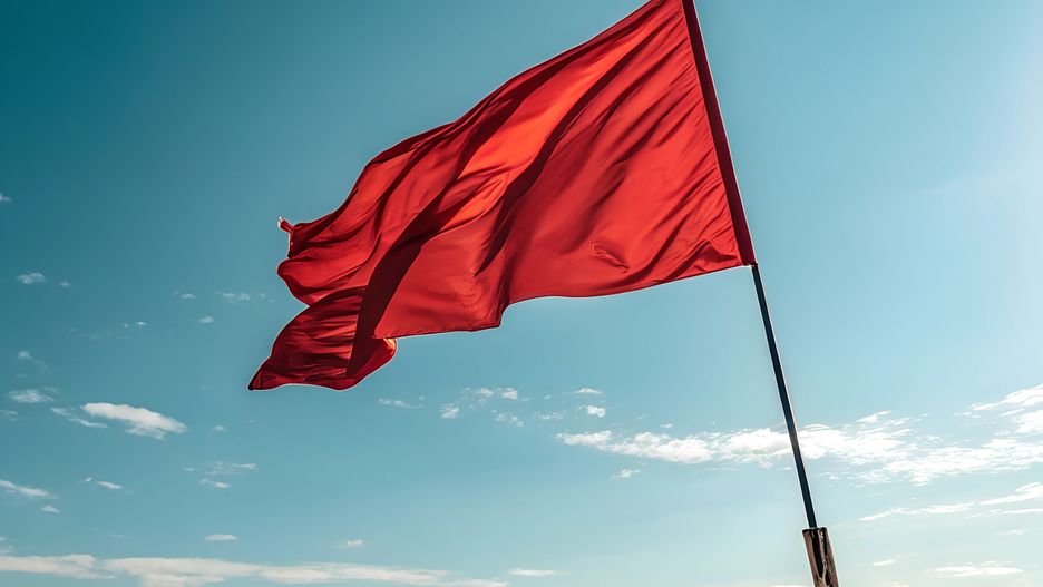 red flag, warning, danger, alert, signal, beach, ocean, sky, warning sign, hazard, risk, caution, safety, emergency, maritime, nautical, coastal, vibrant, blue sky, clouds, wind, waving, fabric, textile, color, symbolic, message, communication, dramatic, attention, stop, prohibition, prevention, important, urgent, notice, banner, signal flag, indicator, alert sign, powerful, intense, strong