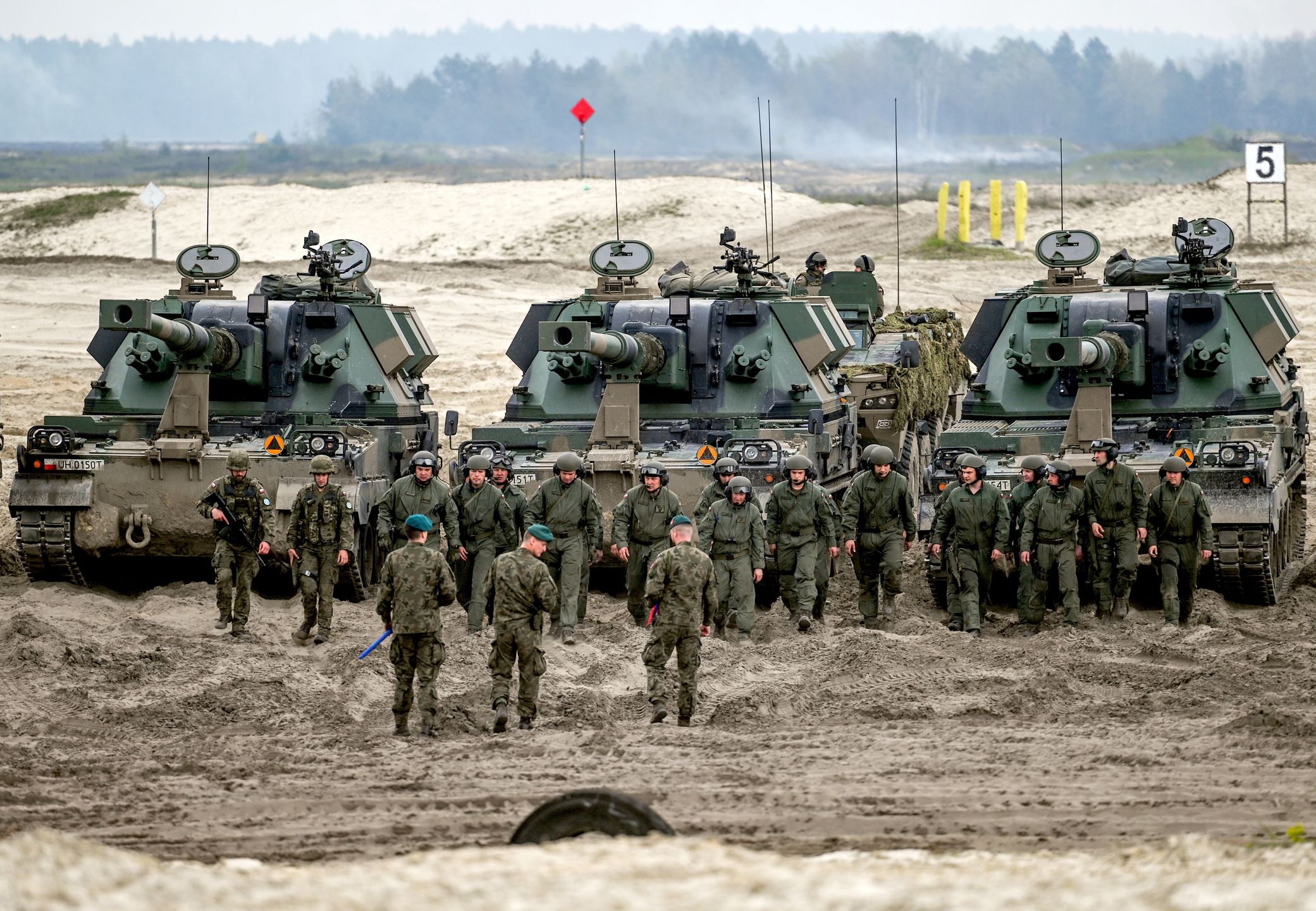 Anakonda-23: Multi-National Military Exercise In Nowa Deba
NOWA DEBA, POLAND - MAY 06, 2023:
Polish army AHS Krab, a 155 mm NATO-compatible self-propelled tracked gun-howitzers and staff, are seen during a high-intensity training session at the Nowa Deba training ground on May 06, 2023 in Nowa Deba, Poland.
Anakonda-23 is the highlight of the Polish Army's training calendar this year. Soldiers from various units, including counterparts from the US, Romania, and Slovenia, will collaborate to achieve military excellence using advanced equipment like F-16s, helicopters, missiles, and mortars. (Photo by Artur Widak/NurPhoto via Getty Images)
NurPhoto
anaconda exercise, military drill, polish army, ahs krab, 155 mm nato-compatible, self-propelled tracked gun-howitzers, staff, nowa deba, training ground, anakonda-23, polish army's training calendar, us romania slovenia f-16s helicopters missiles mortars artur wid