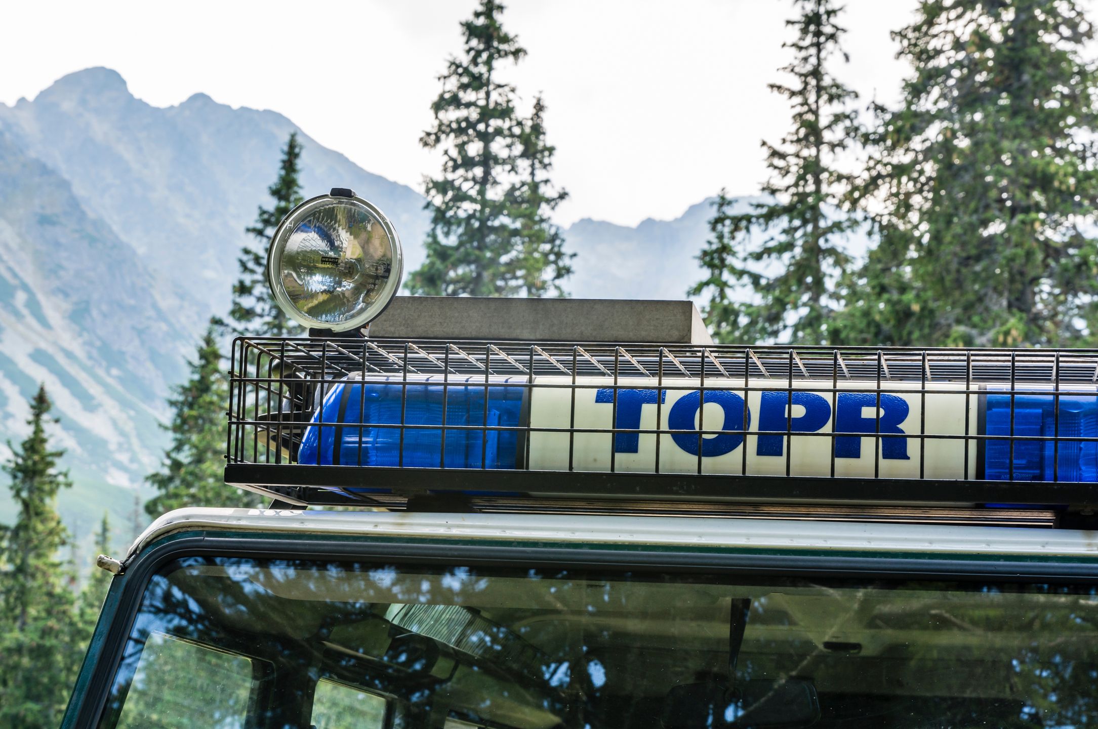 Zakopane, Poland - September 10, 2016: Emergency vehicle - the inscription TOPR at the traffic lights flash.
Pawel (lxix) Gubernat
TOPR, Tatra Volunteer Search and Rescue, Mountain rescue, light, signal light, glass, halogen, sign, lettering, color, green, blue, Poland, voluntary organization, auto, mountain, peak, pass, tree, spruce, Tatras, zakopane, topr, tatra volunteer search and rescue, mountain rescue, light, signal light, glass, halogen, sign, lettering, color, green, blue, poland, voluntary organization, auto, mountain, peak, pass, tree, spruce, tatras, zakopane