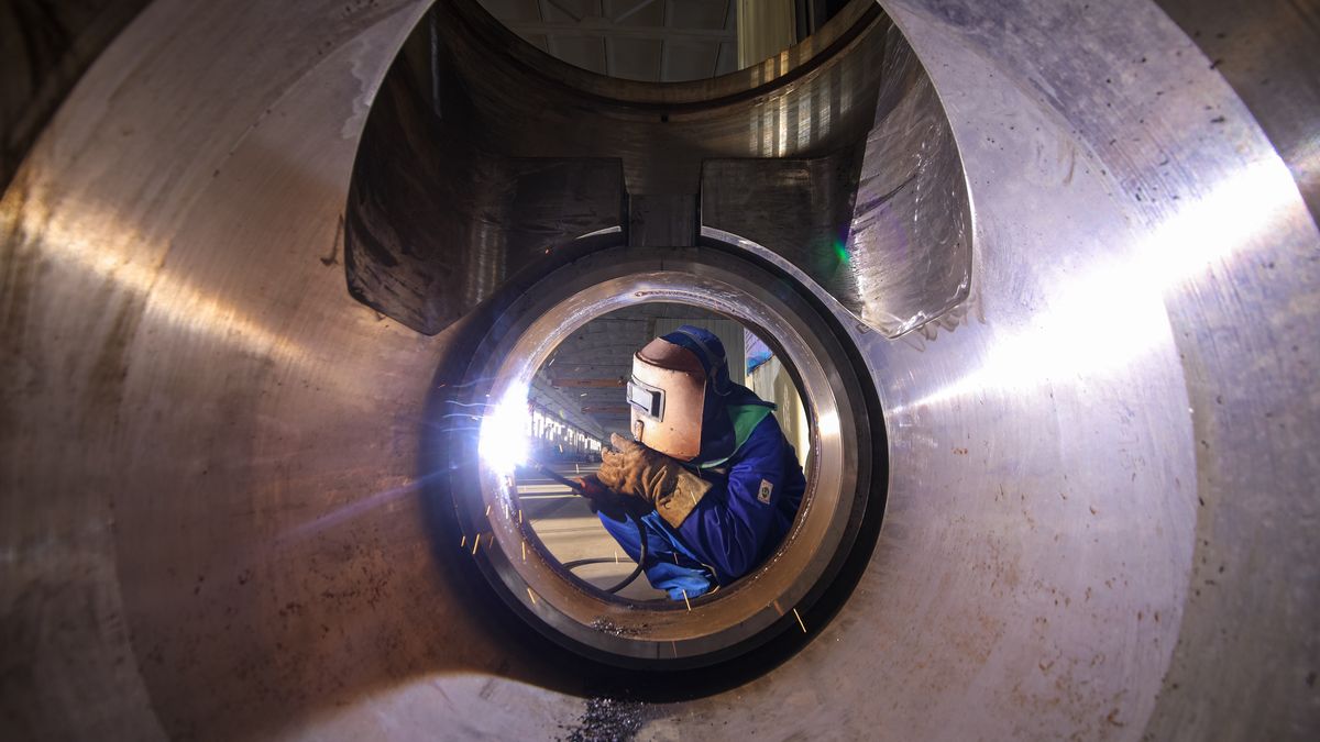 QINGDAO, CHINA - DECEMBER 15: A worker manufactures valves at the workshop of Qingdao Power Station Valve Co., Ltd. on December 15, 2025 in Qingdao, Shandong Province of China. (Photo by Zhang Ying/VCG via Getty Images)