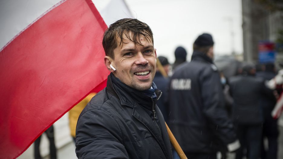 WARSAW, MAZOWIECKIE, POLAND - 2020/10/13: Michal Kolodziejczak waving the Polish flag during the march.
To oppose the so-called "Five for animals" act (Piatka dla zwierzat), Agrounia, the farmers' organisation lead by Michal Kolodziejczak marched through the streets, paralyzing public transport. It is estimated that 70 thousand people took part in the protest. (Photo by Attila Husejnow/SOPA Images/LightRocket via Getty Images)