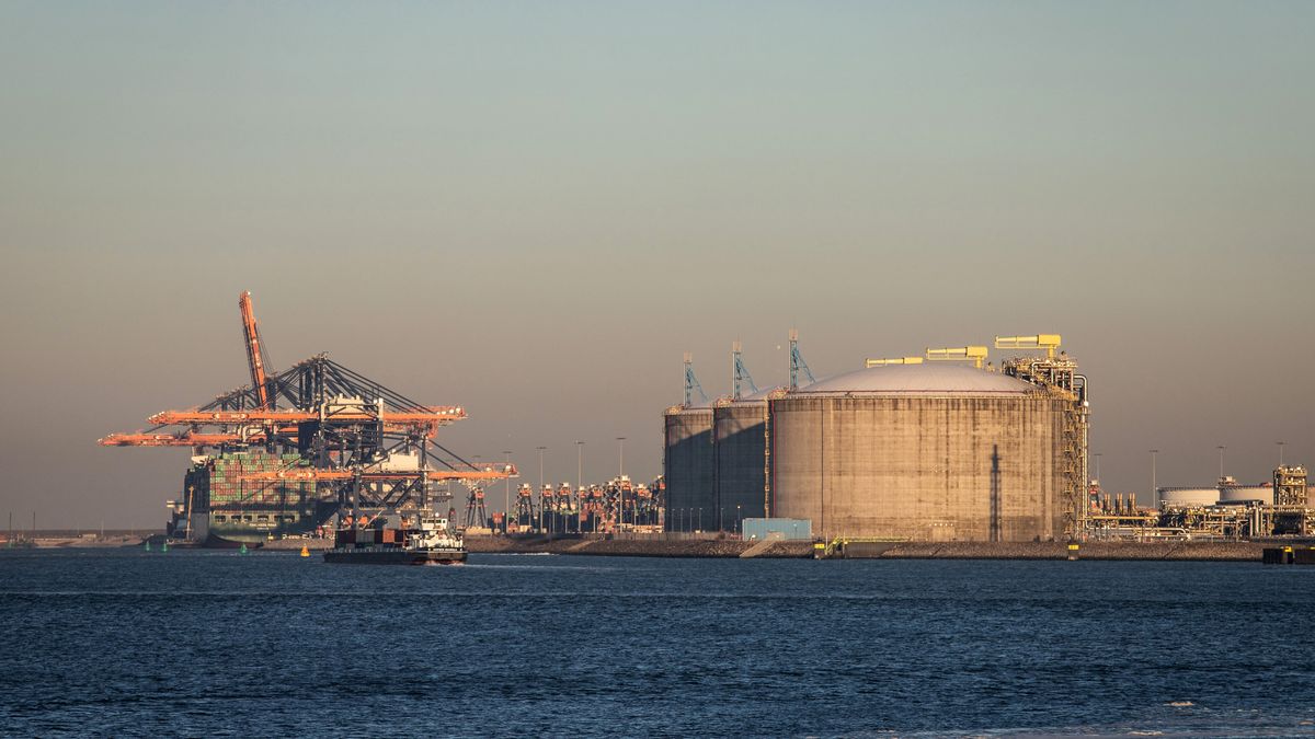 A container ship docked beyond storage tanks at a liquefied natural gas (LNG) terminal at the Port of Rotterdam in Rotterdam, Netherlands, on Tuesday, March 8, 2022. Europe's biggest port is where the sharp end of sanctions against Russia looks likely to hurt the Netherlands, even if the nation's economic statistics might suggest otherwise. Photographer: Peter Boer/Bloomberg via Getty Images