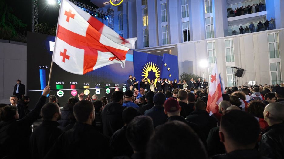 Temporary
Supporters and members of the ruling Georgian Dream party attend a gathering at the party's headquarters after exit polls were announced during parliamentary elections in Tbilisi on October 26, 2024. (Photo by Giorgi ARJEVANIDZE / AFP)
GIORGI ARJEVANIDZE