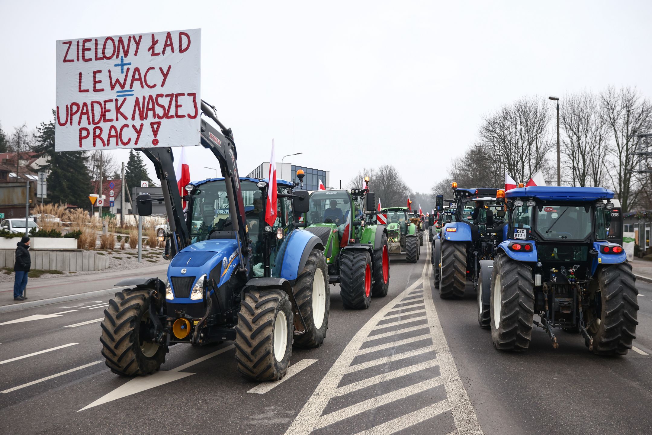 Farmers Protest In PolandFarmers drive tractors into the city center during a nationwide protest against EU climate policies and cheap Ukrainian agricultural products imports. Krakow, Poland on February 9, 2024. Polish farmers are demonstrating across the country, holding blockades and slowing down traffic in the biggest cities. (Photo by Beata Zawrzel/NurPhoto via Getty Images)NurPhotopolish, european, ukrainian, russian, demonstration, manifestation, rally, politicsl city, blockadel traffic, jam, vehicle, banner, green, deal, farmers, tractors, city center, nationwide protest, eu climate policies, cheap ukrainian imports, agricultural products, february 9, polish farmers, demonstrating, countrywide, blockades, slowing down traffic, biggest cities, beata zawrzel, nurphoto, import competition, protest movement