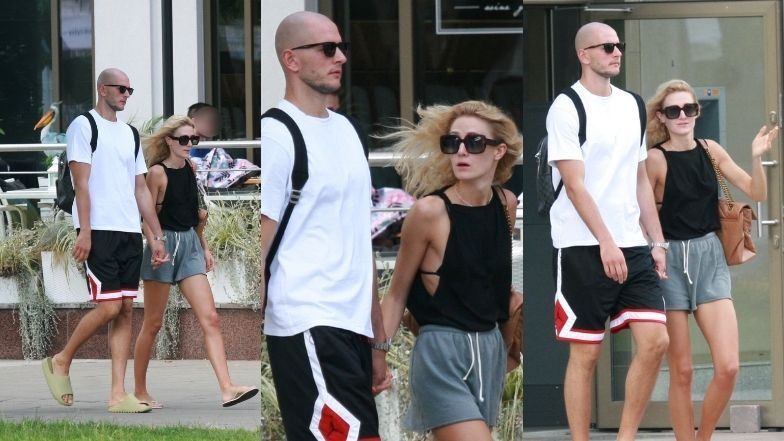 Bartosz Kurek w towarzystwie żony mknie hulajnogą po Sopocie i raczy się zimnym trunkiem