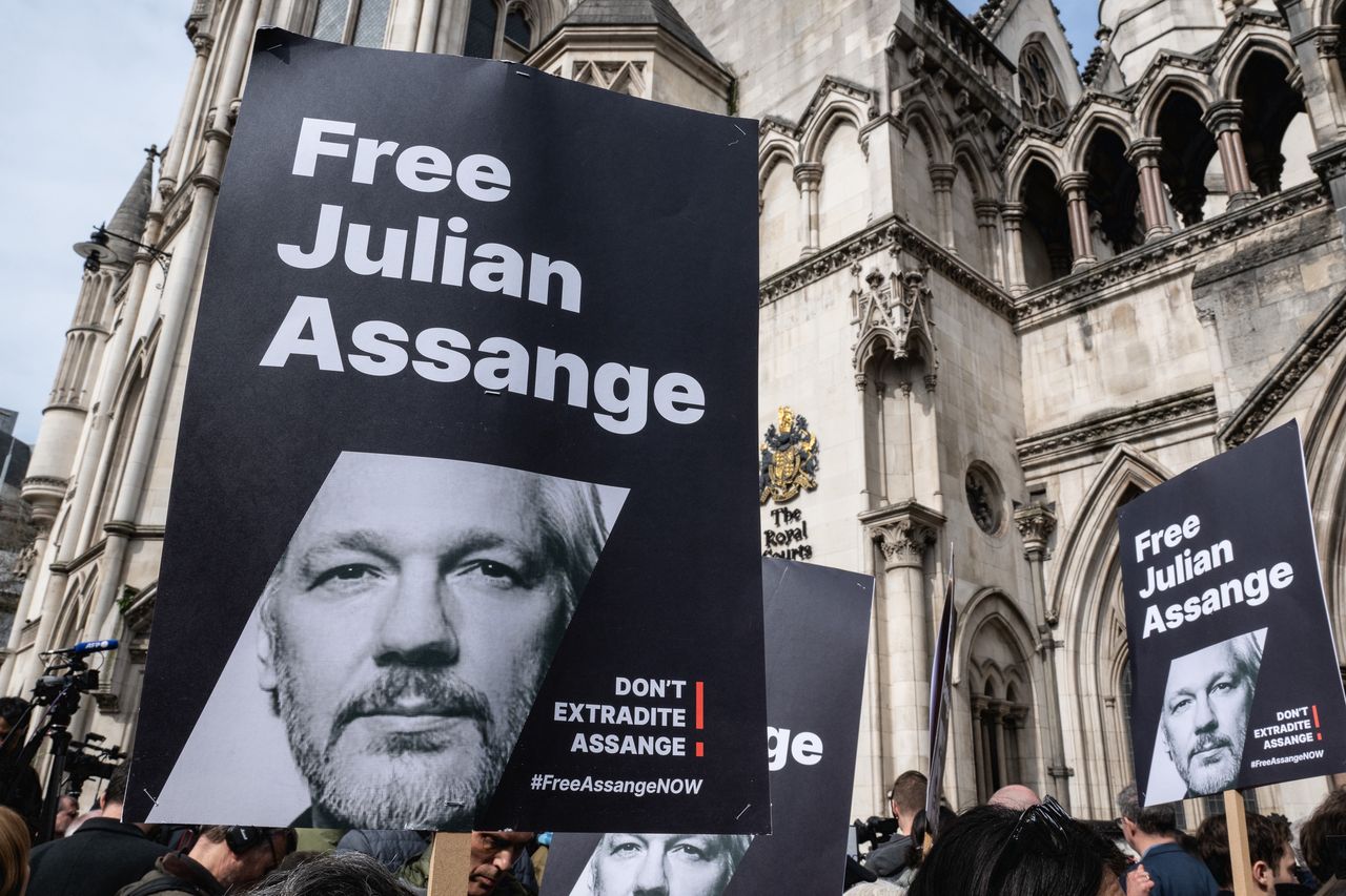 LONDON, ENGLAND - MARCH 26: Supporters of Julian Assange gather at Royal Courts of Justice, Strand on March 26, 2024 in London, England. The decision follows two days of hearings on 20 and 21 February 2024, during which a panel of two high court judges considered Assange's final application to appeal against the extradition order approved by then-Home Secretary Priti Patel in June 2022. The WikiLeaks founder is facing life imprisonment in the US for publishing thousands of classified military and diplomatic documents in 2010, which were provided by US army whistleblower Chelsea Manning. Between 2012 and 2019, Assange received asylum with Ecuador at the Ecuadorian embassy in London on the grounds of political persecution. Since 2019, he has been held at London's Belmarsh Prison as the US extradition case has proceeded. (Photo by Guy Smallman/Getty Images)