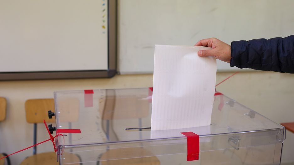 KRAKOW, POLAND - 2023/10/15: A person casts his vote at the electoral commission in Krakow during the 2023 parliamentary elections in Poland. (Photo by Grzegorz Wajda/SOPA Images/LightRocket via Getty Images)