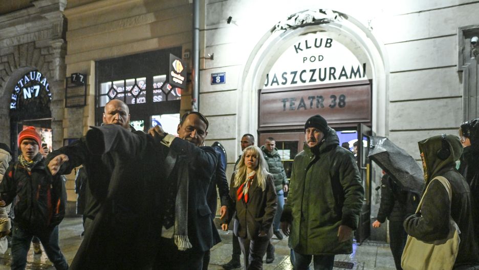 KRAKOW, POLAND  NOVEMBER 25:Poland's Foreign Minister Radosaw Sikorski is evacuated from the Pod Jaszczurami club in Krakow after his book event for 'Z okopu do Europy' ('From the Trench to Europe') was disrupted by pro-Palestinian activists on November 25, 2025.The book offers a broad panorama of his experiences, combining war reporting, analytical essays and personal diplomatic reflections while tracing key events from Afghanistan and Iraq to Central Europe and contemporary international tensions. (Photo by Artur Widak/NurPhoto via Getty Images)