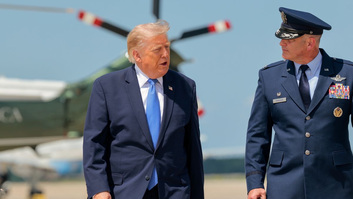 JOINT BASE ANDREWS - AUGUST 04: U.S. President Donald Trump (L) speaks to U.S. Air Force Col. Christopher M. Robinson as he walks to board Air Force One before departing on August 04, 2026 at Joint Base Andrews, Maryland. Trump is traveling to Los Angeles to attend a RNC fund raising event and then onto Las Vegas for a rally on August 5th.  (Photo by Chip Somodevilla/Getty Images)