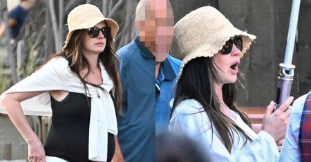 Ciężarna Anne Hathaway wymachuje mieczem świetlnym w Disneylandzie. Cool mama? (ZDJĘCIA)