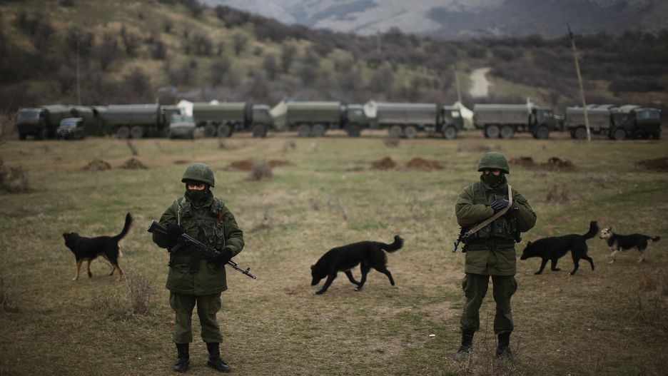 Tensions Grow In Crimea As Diplomatic Talks Continue
SIMFEROPOPL, UKRAINE - MARCH 12:  Armed men believed to be Russian military patrol outside a Ukrainian military base on March 12, 2014 in Simferopol, Ukraine. As the standoff between the Russian military and Ukrainian forces continues in Ukraine's Crimean peninsula, world leaders are pushing for a diplomatic solution to the escalating situation. Crimean citizens will vote in a referendum on 16 March on whether to become part of the Russian federation.  (Photo by Dan Kitwood/Getty Images)
Dan Kitwood
Conflict, War, bestof, bestof, topics, topics, topix, topix, toppics, toppics, toppix, toppix