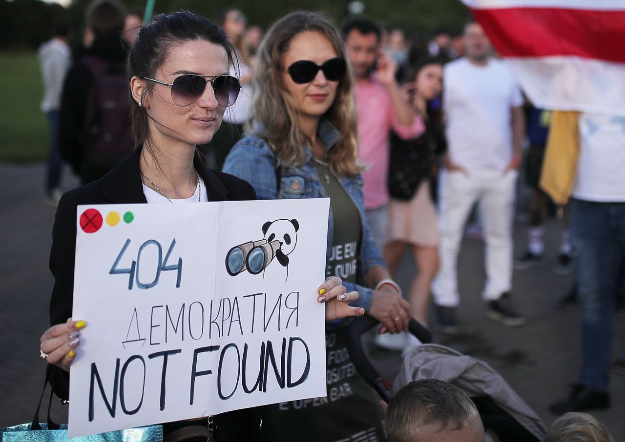 MINSK, BELARUS - SEPTEMBER 4, 2020: People march in support of the IT industry in Victors Square. The Belarusian authorities have taken legal action against Mikita Mikado, founder and one of the top managers of the US-based IT company PandaDoc. The coordination council of the Belarusian opposition believe that the criminal case against Mikado was initiated over assistance that Mikado offered to Belarusian riot police officers and other law enforcement officers who quit their jobs after the 2020 Belarusian presidential election. A sign reads: "404 Democracy Not Found". Sergei Bobylev/TASS (Photo by Sergei Bobylev\TASS via Getty Images)