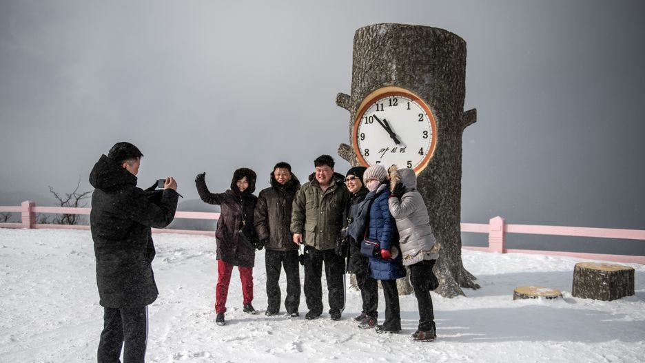 Daily Life In North Korea
WONSAN, NORTH KOREA - FEBRUARY 05: North Korean people pose for a group photograph in front of a concrete tree stump clock as they visit the summit of the 1,360-metre Taehwa Peak at Masikryong Ski Resort on February 05, 2019 near Wonsan, North Korea. U.S President Donald Trump and North Korean Supreme Leader Kim Jong Un will hold a second summit in the Vietnamese capital of Hanoi later this month following a historic summit in Singapore last June. Although the two countries remain technically at war and with negotiations surrounding the details of North Korea's nuclear disarmament continuing, President Trump has hailed Kim Jong Un and North Korea with a tweet in which he predicted that the country would become "a great economic powerhouse" thanks to Mr Kim's leadership. (Photo by Carl Court/Getty Images)
Carl Court
politics, government, human interest, cultures, people, north korea