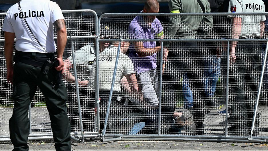 Temporary
Picture taken on May 15, 2024 shows security personnel apprehending a suspected gunman (C/GROUND) after Slovakia's Prime Minister was shot in Handlova, Slovakia on May 15, 2024. Slovakia's Prime Minister Robert Fico was battling life-threatening wounds after officials said he was shot multiple times in an assassination attempt condemned by European leaders. (Photo by AFP) / ALTERNATIVE CROP
-