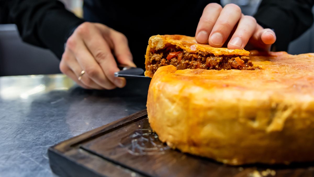 cooking, chef, food, meat, pie, restaurant, kitchen, pork, crust, pastry, yorkshire, meal, cuisine, lunch, baked, spicy, traditional, british, unhealthy, sliced, open, people, table, cake, healthy, cafe, culinary, dough, gastronomy, knife, professional, prepare, enjoying, preparation, one person, indoor, recipe, eat, cook, chicken, plate, man, hand, cheese, stuffing, close, slicing, closeup, cutting