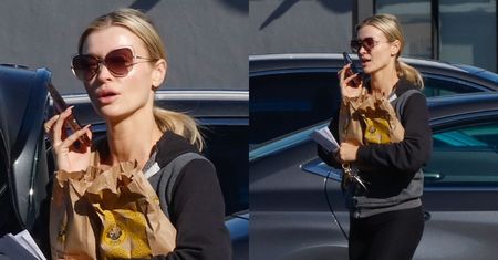 Naturalna Joanna Krupa z bajglami pod pachą wisi na telefonie w Los Angeles (ZDJĘCIA)
