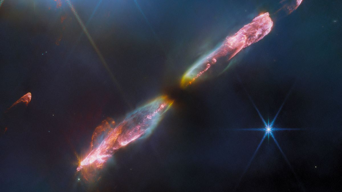 Gwiazda HH 211 wraz ze wstęgą ujęta przez JWST za pomocą instrumentu NIRCam.