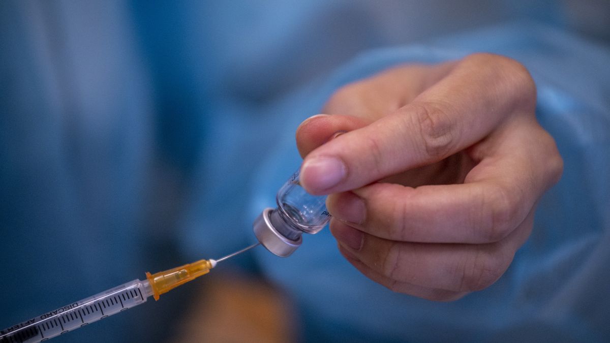 A syringe containing the Sinova CoronaVac vaccine made by Sinovac Biotech Ltd. a Chinese biopharmaceutical company is seen at a Vaccination Center on August 11, 2022 in Hong Kong, China. Hong Kong has recently lower to age limit to six months for receiving Sinovac Covid-19 jab,  (Photo by Vernon Yuen/NurPhoto via Getty Images)