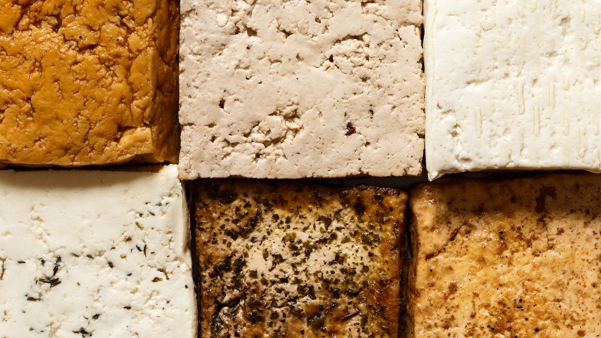 Background of different klinds of tofu blocks from above.Background of different klinds of tofu blocks from above.tofu, background, blocks, white, natural, herbs, smoked, lightly, marinated, above, selection, closeup, bean, curd, soya, vegetarian, chinese, asian, japanese, traditional, protein, healthy, soy, diet, top, flavored, seasoned, alternative, abstract, arranged, whole, mix