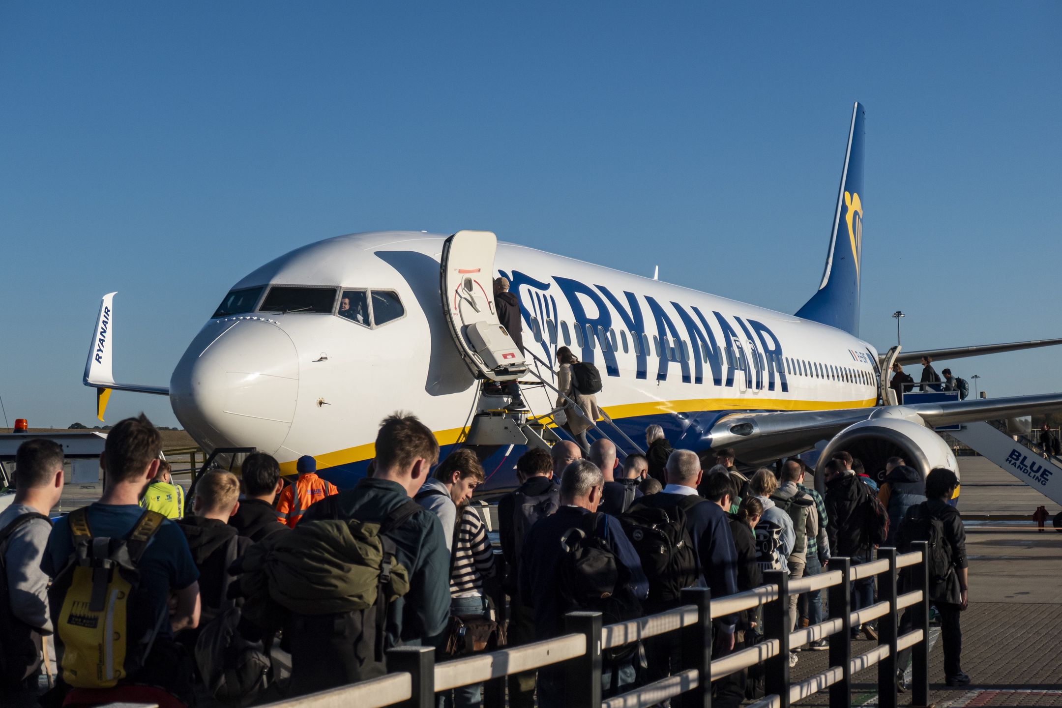 Passengers waiting in line and boarding a Ryanair low cost airline airplane at London Stansted Airport in the UK. The Boeing 737-800 passenger aircraft of the budget carrier has the registration tail number EI-ENF. Ryanair is an Irish Ultra Low-cost carrier group with headquarters in Dublin, Ireland with a fleet of 607 planes. Stansted Airport is the tertiary international airport serving London, the capital of England and the United Kingdom, fourth busiest in the UK owned by Manchester Airports Group. Stansted, United Kingdom on October 11, 2024 (Photo by Nicolas Economou/NurPhoto via Getty Images)