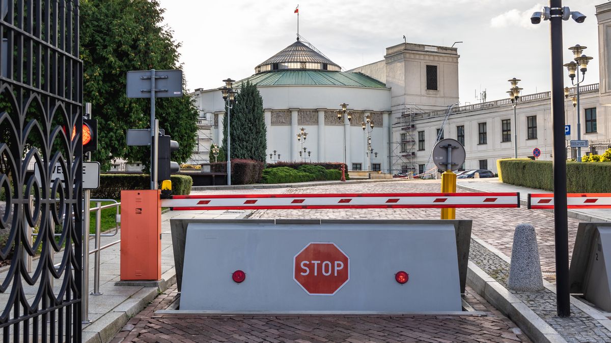 Main building of Polish Sejm and Senat complex in Warsaw, PolandKonrad ZelazowskiParliament, Warsaw, Sejm, Seym, Poland, Polish, Meeting Hall, Varsovia, Warszawa, capital, city, Wiejska, travel, tourism, tourist attraction, travel destination, landmark, building, architecture, famous, sightseeing, lower, house, politic, trees, cloud, flag, street, government, administration, cabinet, white, policy, politics, national, state, oval, complex, stop, sign, barrier, parliament, warsaw, sejm, seym, poland, polish, meeting hall, varsovia, warszawa, capital, city, wiejska, travel, tourism, tourist attraction, travel destination, landmark, building, architecture, famous, sightseeing, lower, house, politic, trees, cloud, flag, street, government, administration, cabinet, white, policy, politics, national, state, oval, complex, stop, sign, barrier