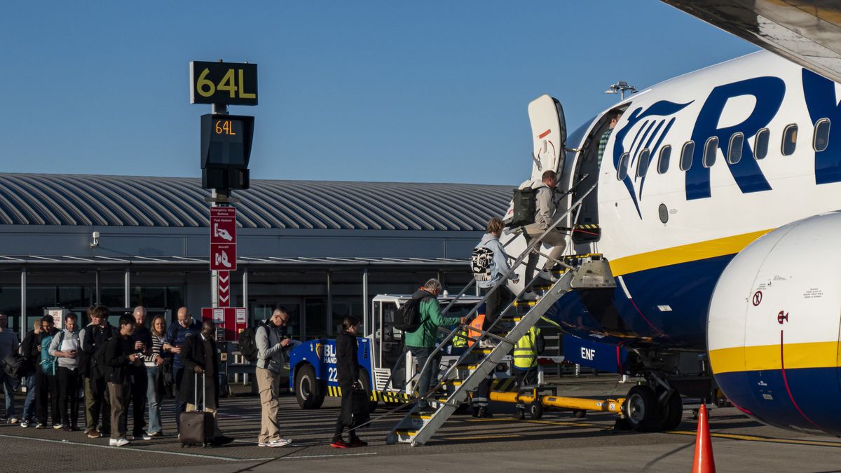 Passengers waiting in line and boarding a Ryanair low cost airline airplane at London Stansted Airport in the UK. The Boeing 737-800 passenger aircraft of the budget carrier has the registration tail number EI-ENF. Ryanair is an Irish Ultra Low-cost carrier group with headquarters in Dublin, Ireland with a fleet of 607 planes. Stansted Airport is the tertiary international airport serving London, the capital of England and the United Kingdom, fourth busiest in the UK owned by Manchester Airports Group. Stansted, United Kingdom on October 11, 2024 (Photo by Nicolas Economou/NurPhoto via Getty Images)