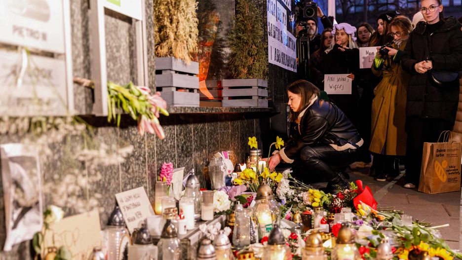 WARSAW, POLAND - 2024/03/06: Flowers, lanterns, and photos lie at the memorial site during the "Her Name Was Liza" march. Thousands of people took to the streets in Warsaw to participate in a march protesting against sexual violence, united under the movement 'Her Name Was Liza.' This demonstration was not only a tribute to the memory of Liza, a Belarusian woman who tragically lost her life but also served as a collective outcry against the pervasive violence that plagues society. Liza, 25, was assaulted on February 25, 2024. She later passed away on March 1, 2024. The perpetrator, a 23-year-old resident, was arrested. Liza, a refugee, came to Poland from Belarus. (Photo by Volha Shukaila/SOPA Images/LightRocket via Getty Images)