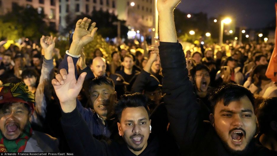 Temporary
Migrants from Bangladesh react when addressed in their own language during speeches at the end of a demonstration against racism that gathered thousands, in Lisbon, Saturday, Jan. 11, 2025. (AP Photo/Armando Franca)
Armando Franca