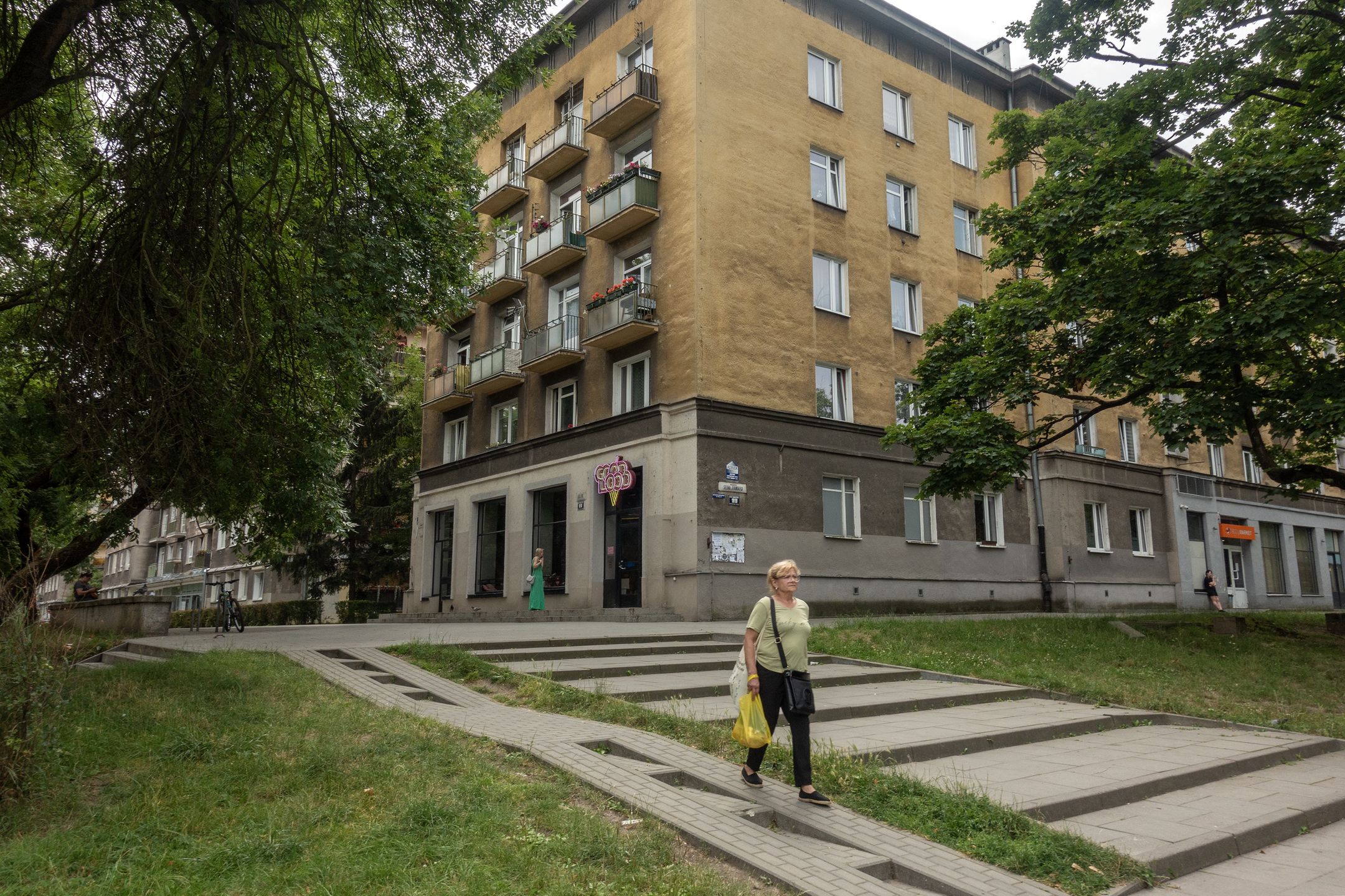 KRAKOW, POLAND - JUNE 28: Visitors and citizens spend time as daily life continues in the Nowa Huta district, built from scratch as a workers' district in the 1950s for the workers of the Vladimir Lenin Steelworks and their families, on June 28, 2024 in Krakow, Poland. Considered one of the important examples of Soviet architecture, the region stands out as an important visit point for both tourists and history enthusiasts. (Photo by Ayhan Mehmet/Anadolu via Getty Images)