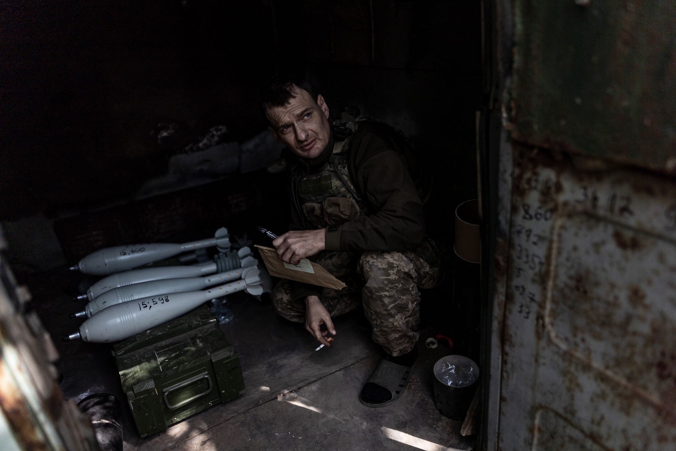 DONETSK OBLAST, UKRAINE - 22 MAY: Ukrainian soldier waiting orders next to mortar shells, in their fighting position, in the direction of Chasiv Yar, Ukraine, on May 22, 2024. (Photo by Diego Herrera Carcedo/Anadolu via Getty Images)