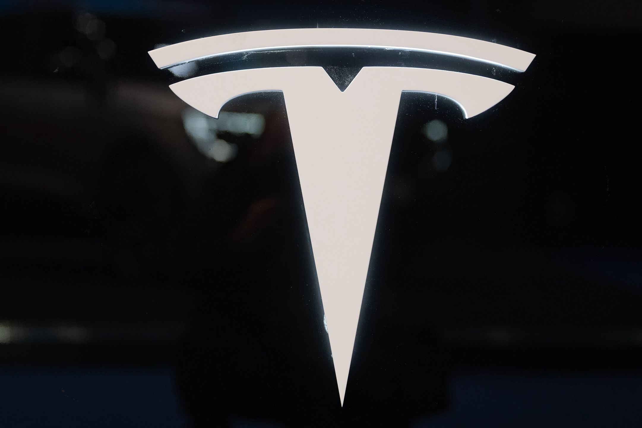 BARCELONA, SPAIN - MAY 12: Car Tesla logo is seen at the Automobile Barcelona International Motor Show in Barcelona, Spain on May 12, 2023. (Photo by Adria Puig/Anadolu Agency via Getty Images)
