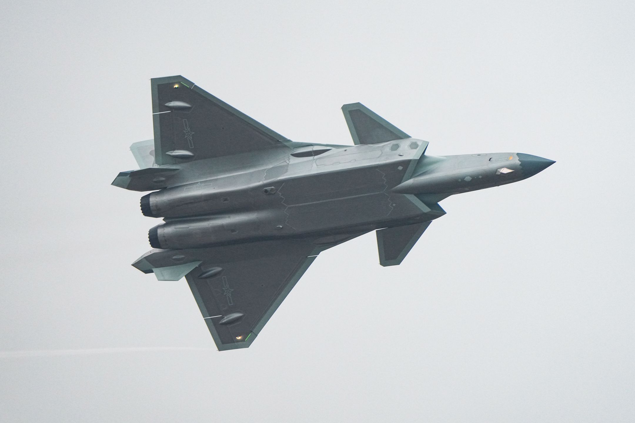 ZHUHAI, CHINA - NOVEMBER 14: The J-20 stealth fighter flies in the sky on day 3 of the 15th China International Aviation and Aerospace Exhibition, or Airshow China 2024, at the China International Aviation & Aerospace Exhibition Center on November 14, 2024 in Zhuhai, Guangdong Province of China. (Photo by Song Zeyi/VCG via Getty Images)