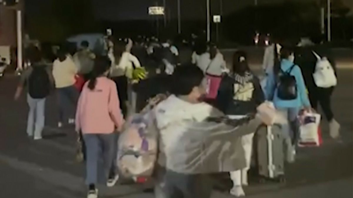 Temporary
In this photo taken from video footage and released by Hangpai Xingyang, people with suitcases and bags are seen leaving from a Foxconn compound in Zhengzhou in central China's Henan Province on Saturday, Oct. 29, 2022. Workers in a Foxconn facility in the central Chinese city of Zhengzhou appear to have left the facility to avoid COVID-19 curbs, with many traveling by foot days after an unknown number of factory workers were quarantined in the facility following a virus outbreak. (Hangpai Xingyang via AP)
Hangpai Xingyang