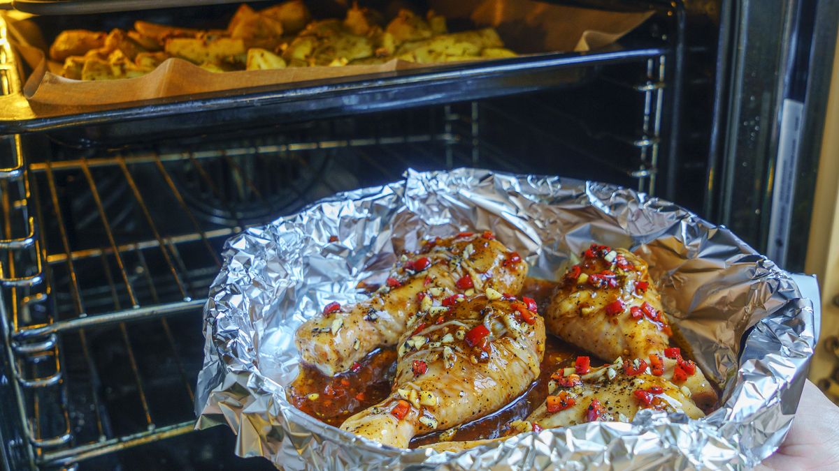 Chicken legs in a red marinade on a cooking board. Pickled raw meat. Dietary meat. Cooking. Raw marinated chicken legs for grill and bbq.Chicken legs in a red marinade on a cooking board. Pickled raw meat. Dietary meat. Cooking. Raw marinated chicken legs for grill and bbq.Ivan Murauyou