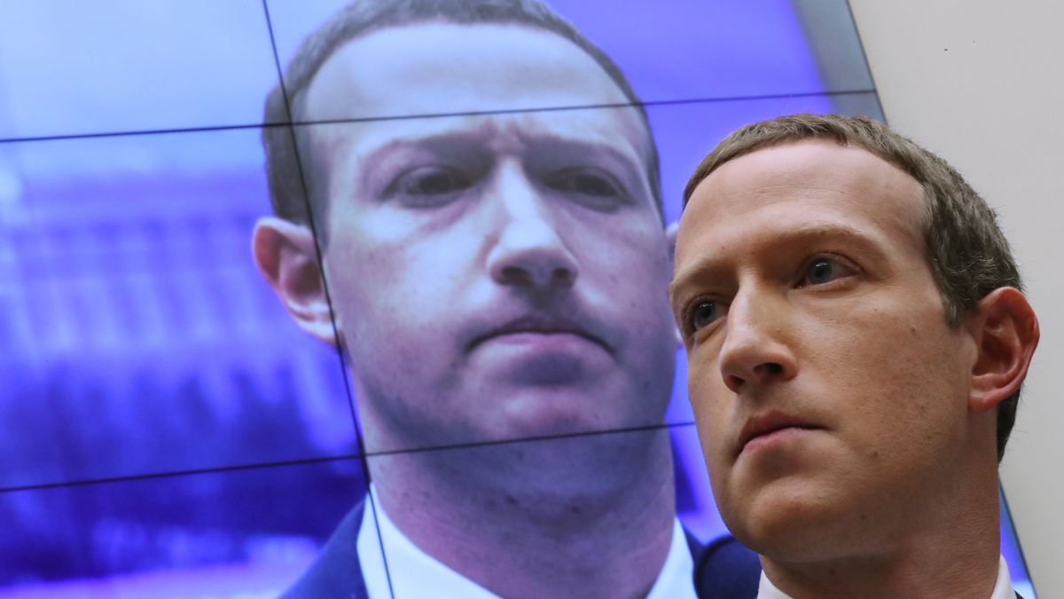 WASHINGTON, DC - OCTOBER 23: With an image of himself on a screen in the background, Facebook co-founder and CEO Mark Zuckerberg testifies before the House Financial Services Committee in the Rayburn House Office Building on Capitol Hill October 23, 2019 in Washington, DC. Zuckerberg testified about Facebook's proposed cryptocurrency Libra, how his company will handle false and misleading information by political leaders during the 2020 campaign and how it handles its users’ data and privacy. (Photo by Chip Somodevilla/Getty Images)