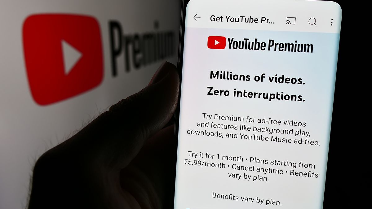 GERMANY - 2024/09/25: In this photo illustration, a person is holding a smartphone with the webpage of video streaming subscription service YouTube Premium in front of logo. (Photo Illustration by Timon Schneider/SOPA Images/LightRocket via Getty Images)