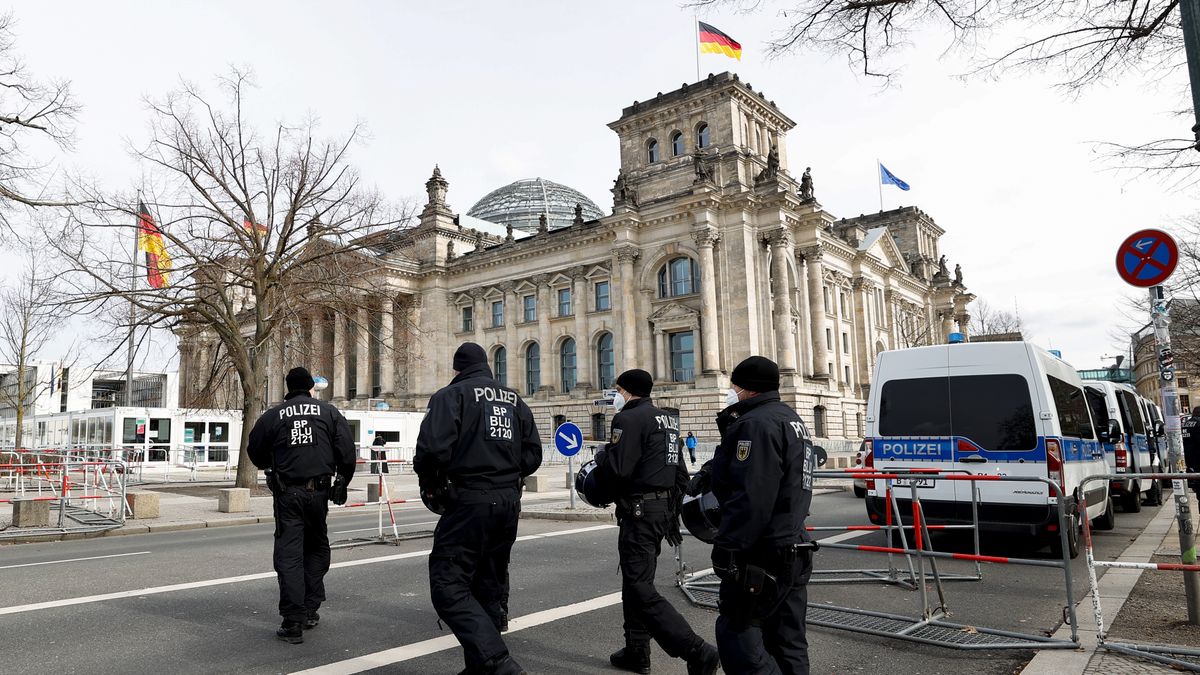 BERLIN, GERMANY - MARCH 20: People gather around Brandenburg Gate to stage a protest against coronavirus (Covid-19) measures in Berlin, Germany on March 20, 2021. Police officers ended the demonstration on the grounds that the mask and distance rules were not followed. The demonstrators were later removed from the area accompanied by the police. Many people were detained in the protest. (Photo by Abdulhamid Hosbas/Anadolu Agency via Getty Images)