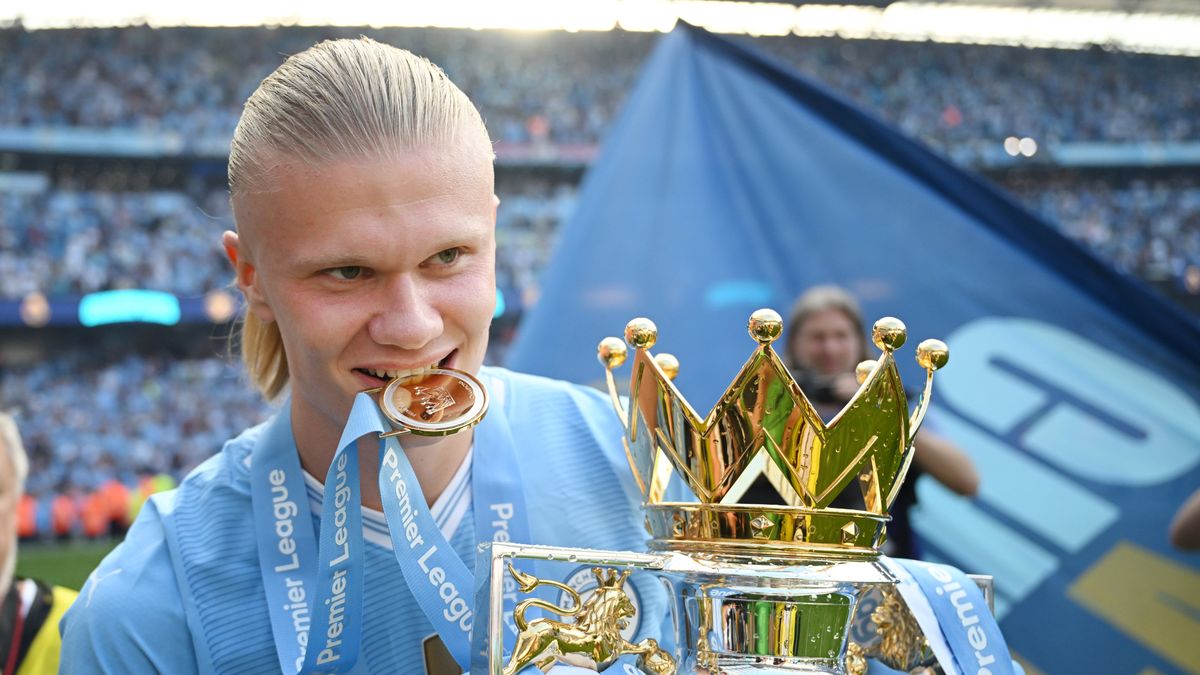 MANCHESTER, ENGLAND - MAY 19: Erling Haaland of Manchester City poses with the Premier League trophy after the Premier League match between Manchester City and West Ham United at Etihad Stadium on May 19, 2024 in Manchester, England. (Photo by Michael Regan/Getty Images)