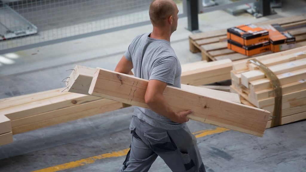 End Of Cheap Labor Era Leaves Poles Scrambling To Find Workers
A worker carries cut timber used in the manufacture of pre-fabricated homes at the Danwood SA factory in Bielsk Podlaski, Poland, on Thursday, Aug. 23, 2017. Its the end of an era of cheap and ample labor that underpinned their transition from communism, with growing complaints that a labor dearth is threatening to foil production plans. Photographer: Piotr Malecki/Bloomberg via Getty Images
Bloomberg
UK Vote on EU Membership, Homes, Manufacturing, House Building, EMEA, Real Estate, Brexit2016, Development, Construction Workers, Fabrication, EAME, Property, Industry, EU, Construction, E.U., Europe, TOPNEWS, Business Finance and Industry
