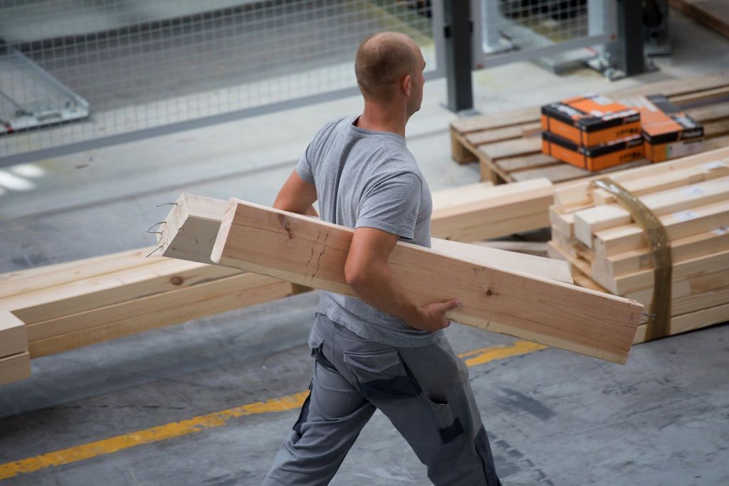 End Of Cheap Labor Era Leaves Poles Scrambling To Find Workers
A worker carries cut timber used in the manufacture of pre-fabricated homes at the Danwood SA factory in Bielsk Podlaski, Poland, on Thursday, Aug. 23, 2017. Its the end of an era of cheap and ample labor that underpinned their transition from communism, with growing complaints that a labor dearth is threatening to foil production plans. Photographer: Piotr Malecki/Bloomberg via Getty Images
Bloomberg
UK Vote on EU Membership, Homes, Manufacturing, House Building, EMEA, Real Estate, Brexit2016, Development, Construction Workers, Fabrication, EAME, Property, Industry, EU, Construction, E.U., Europe, TOPNEWS, Business Finance and Industry