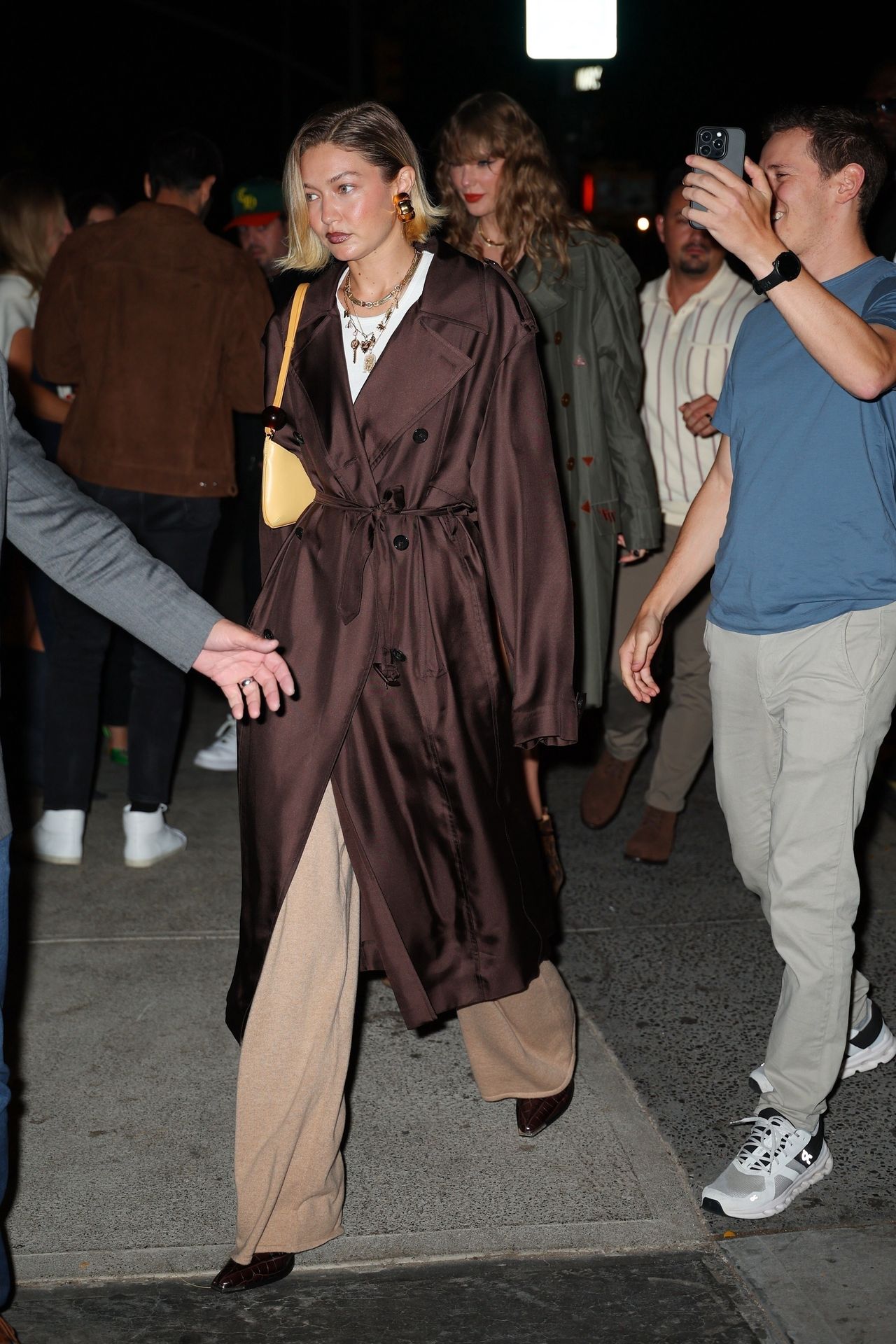 Gigi Hadid opted for a chocolate-colored trench coat.