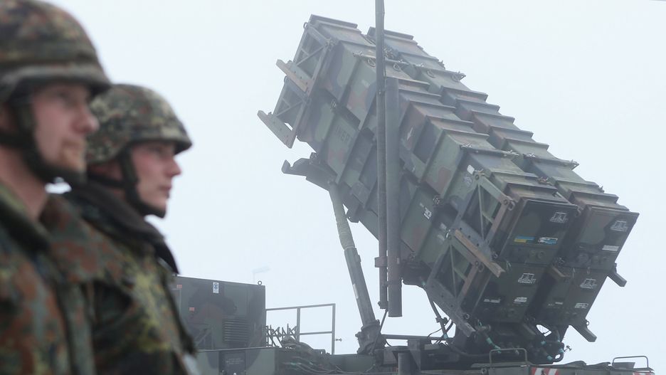Germany To Send Patriot Missiles To Turkey
WARBELOW, GERMANY - DECEMBER 18:  Members of the German Bundeswehr stand at attention next to Patriot missile launching system during a press day presentation at the Luftwaffe Warbelow training center on December 18, 2012 in Warbelow, Germany. Germany, along with the USA and the Netherlands, will send two Patriot systems to Turkey in January to protect Turkey from Syrian attacks.  (Photo by Sean Gallup/Getty Images)
Sean Gallup
Conflict, Military, NATO, Patriots, Politics, War, defence