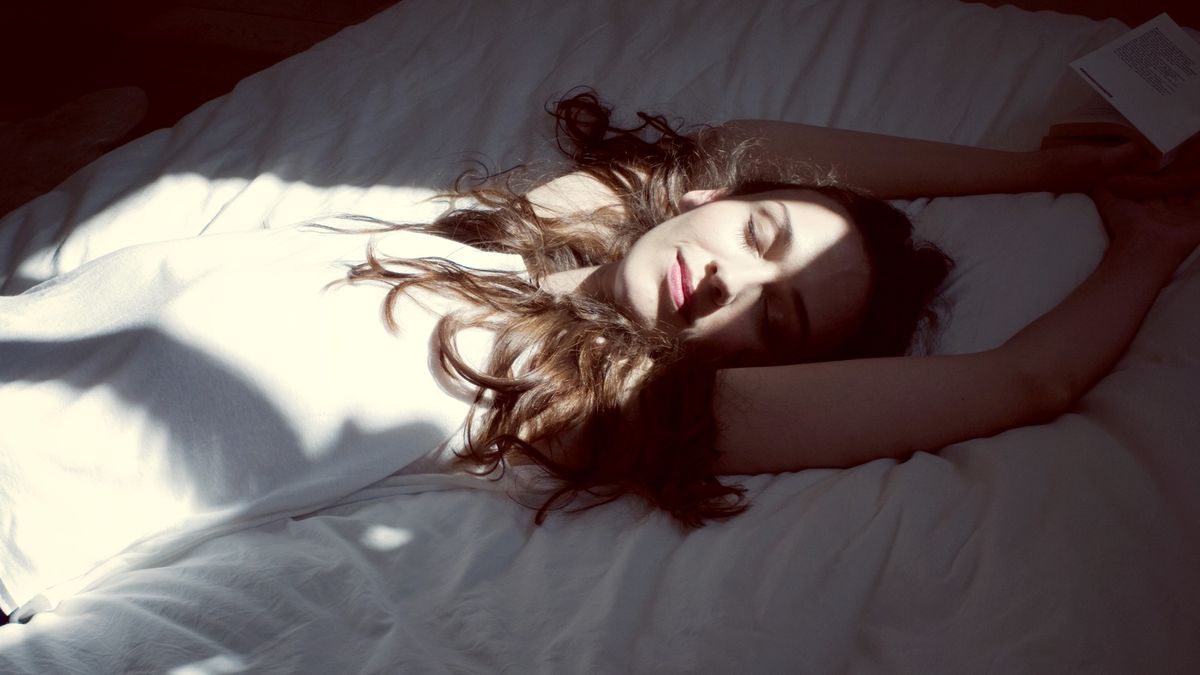 Mid-adult woman relaxing on bedPhotoAlto/Anne-Sophie Bost30-34 years, adult, adults only, arms raised, asleep, bed, bedroom, book, brunette, casual clothes, color image, day, enjoyment, europe, eyes closed, france, high angle view, horizontal, indoors, long hair, lying on back, mid-adult, mid-adult woman, morning, napping, one mid-adult woman only, one person, one woman only, only mid-adult women, only mid-adults, only women, paris, relaxation, relaxed, sensual pleasure, serene people, smiling, sunbeam, tranquility, waist up, weekend, woman