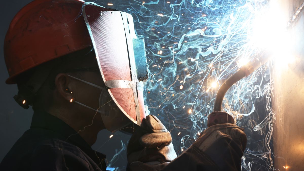 HUZHOU, CHINA - DECEMBER 16: A worker welds core equipment for photovoltaic projects at Zhejiang Dachuan Air Separation Plant Co., Ltd. on December 16, 2025 in Huzhou, Zhejiang Province of China. The core equipment for photovoltaic projects will be exported to Southeast Asian countries. (Photo by Ni Lifang/VCG via Getty Images)