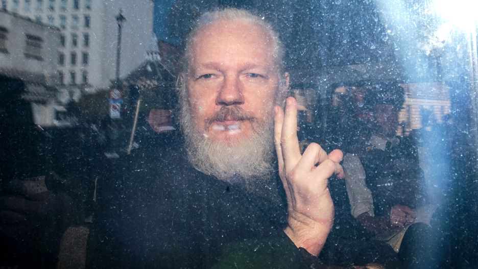 Julian Assange Appears At Westminster Magistrates CourtLONDON, ENGLAND - APRIL 11: Julian Assange gestures to the media from a police vehicle on his arrival at Westminster Magistrates court on April 11, 2019 in London, England.  After weeks of speculation Wikileaks founder Julian Assange was arrested by Scotland Yard Police Officers inside the Ecuadorian Embassy in Central London this morning. Ecuador's President, Lenin Moreno, withdrew Assange's Asylum after seven years citing repeated violations to international conventions. (Photo by Jack Taylor/Getty Images)Jack Taylorlondon, bestof, topix