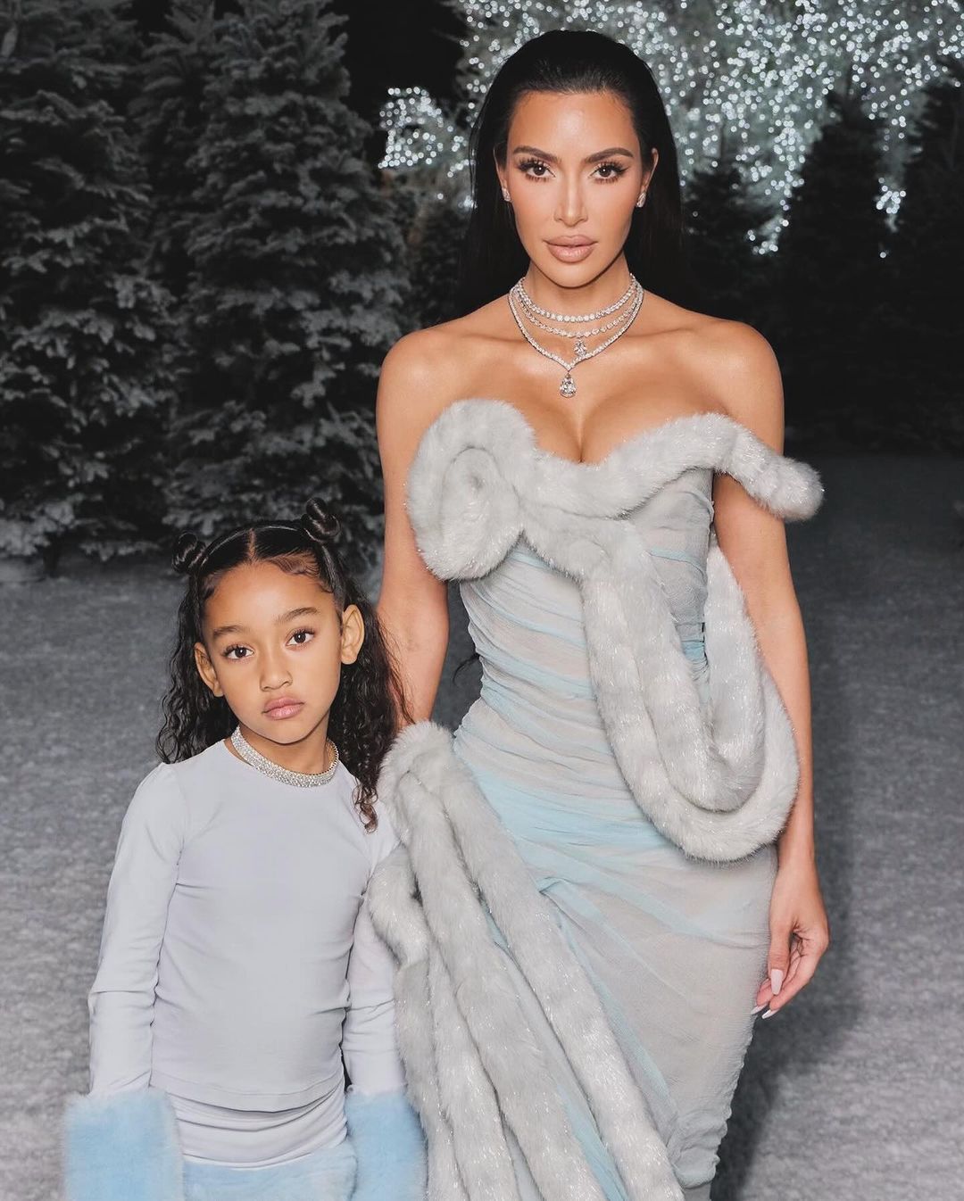 Kim Kardashian with kids at a holiday party
