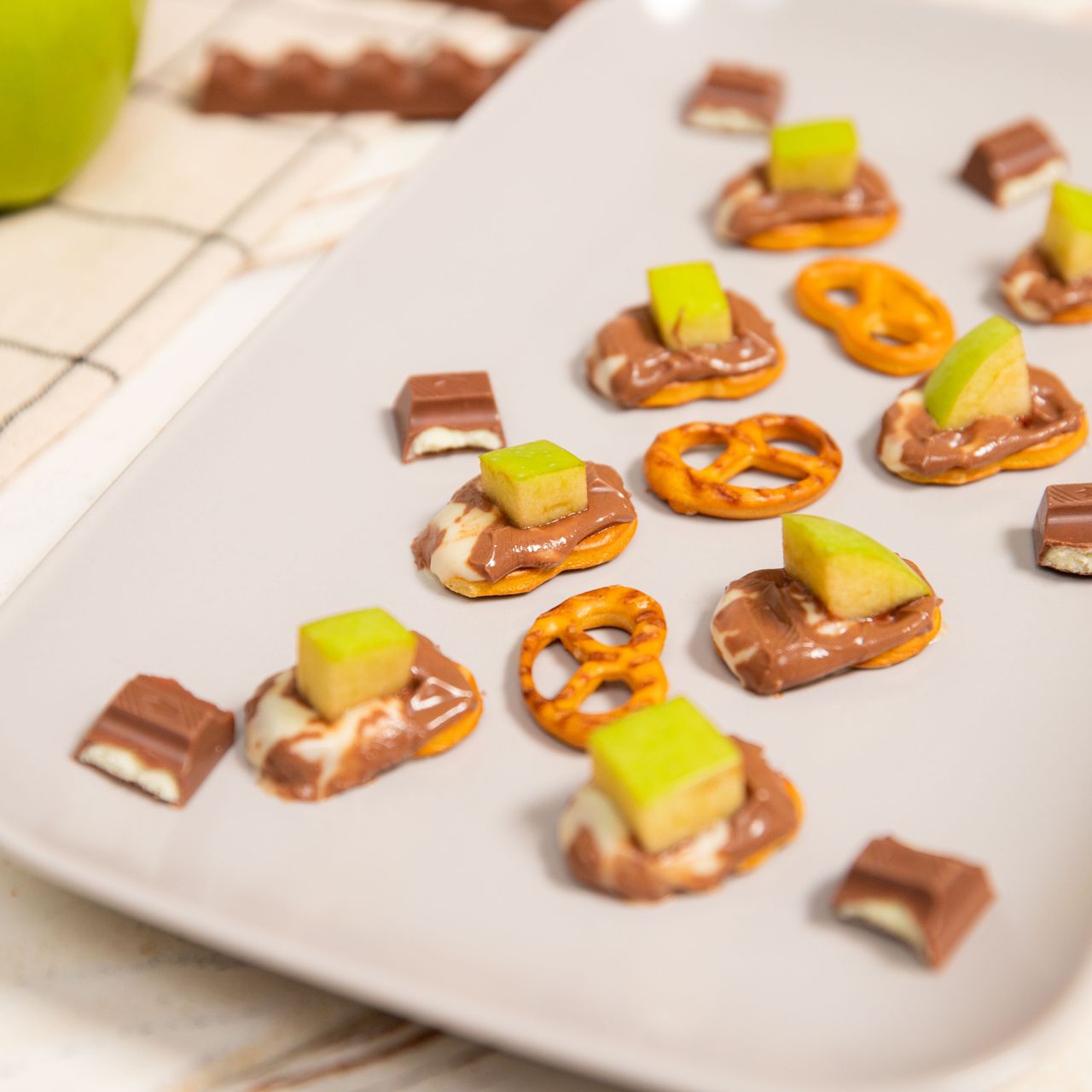 Pretzels with chocolate and apple