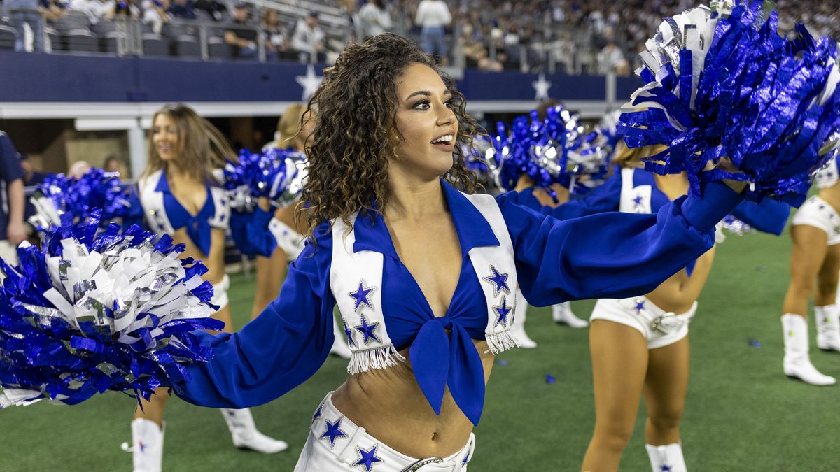 ARLINGTON, TEXAS - DECEMBER 26:  Dallas Cowboy Cheerleader performs before a game against the Washington Football Team at AT&T Stadium on December 26, 2021 in Arlington, Texas.  The Cowboys defeated the Football Team 56-14.  (Photo by Wesley Hitt/Getty Images)