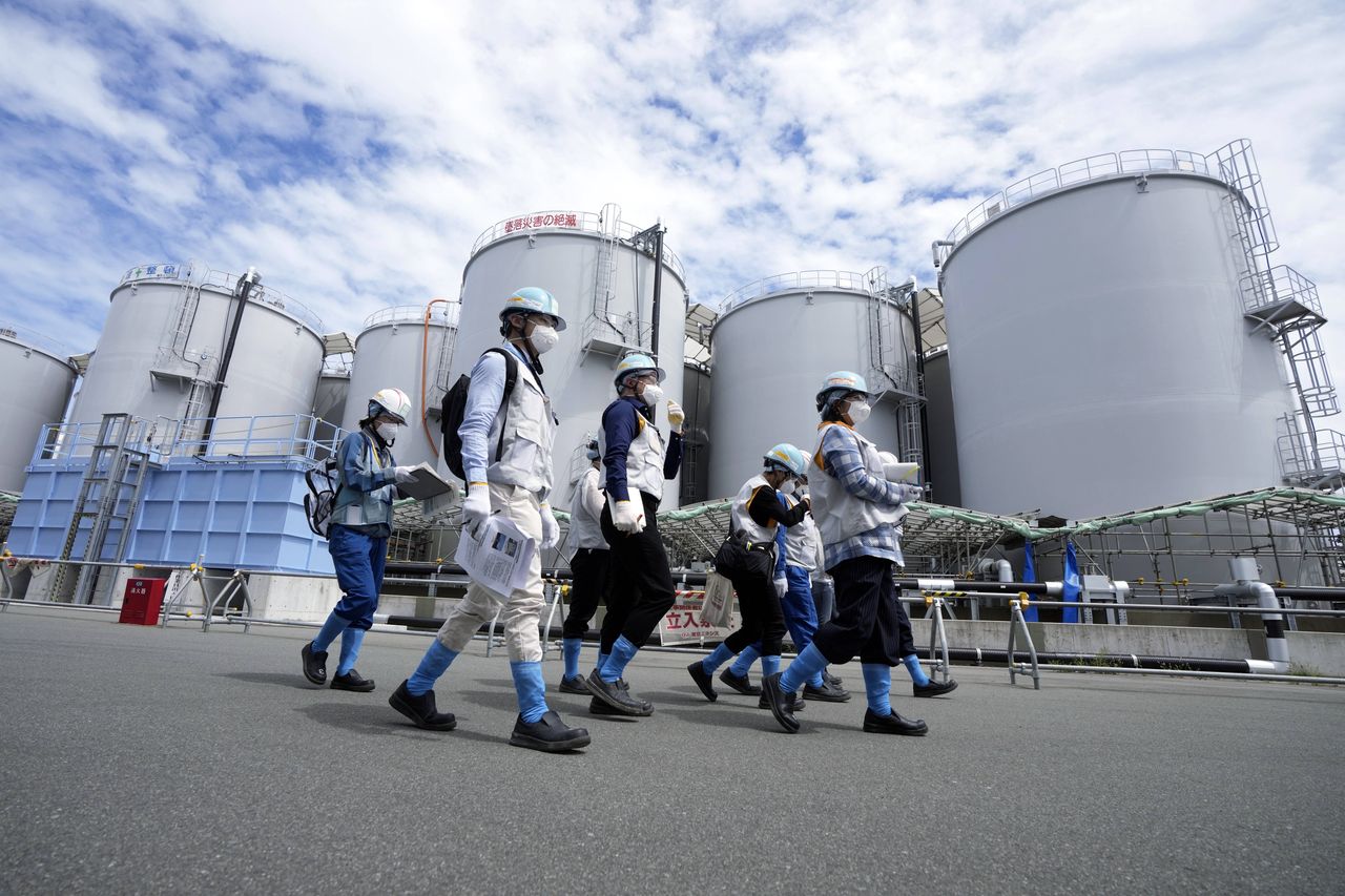 Fukushima halts sea water discharge after earthquake, amid dismantling efforts