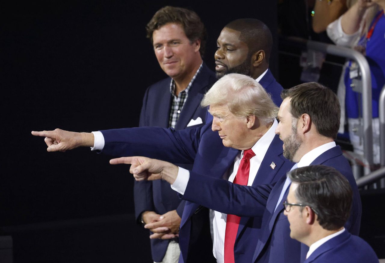 In the photo from left: Tucker Carlson, Byron Donalds, Donald Trump, J.D. Vance, and Mike Johnson